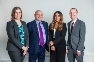 Litigation team photo of four key people